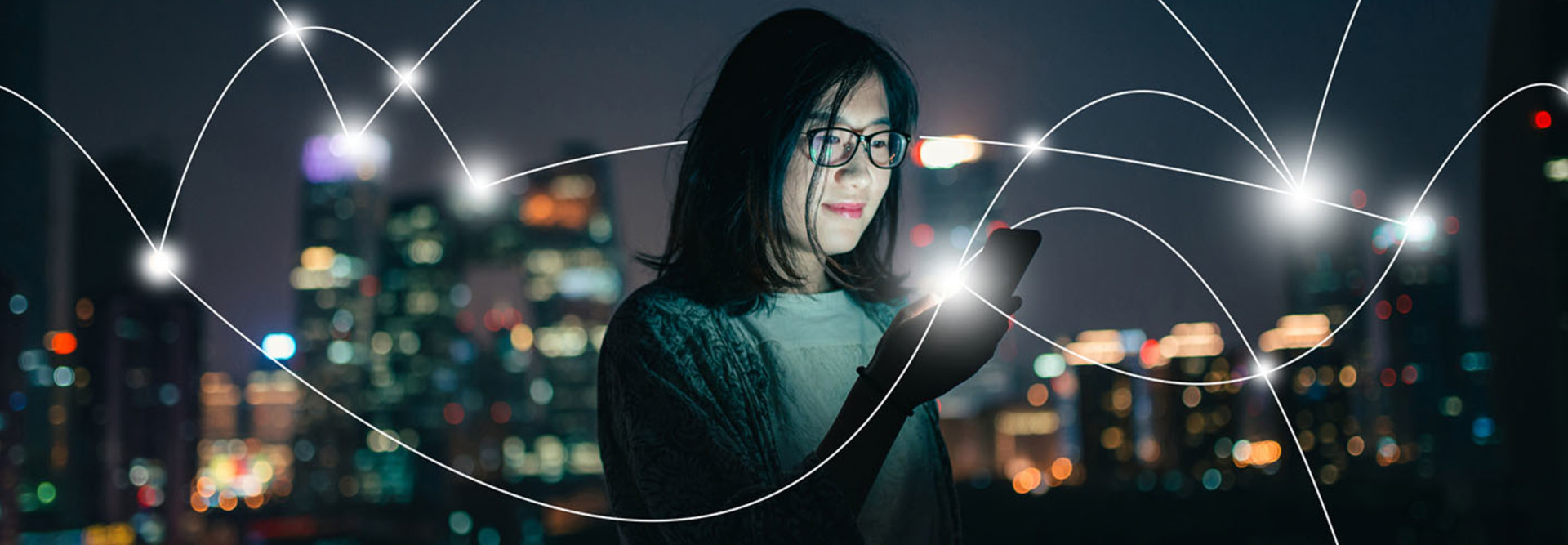 Woman with phone connecting to city