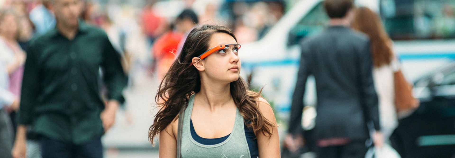 Teenage girl wearing Google Glass in Times Square