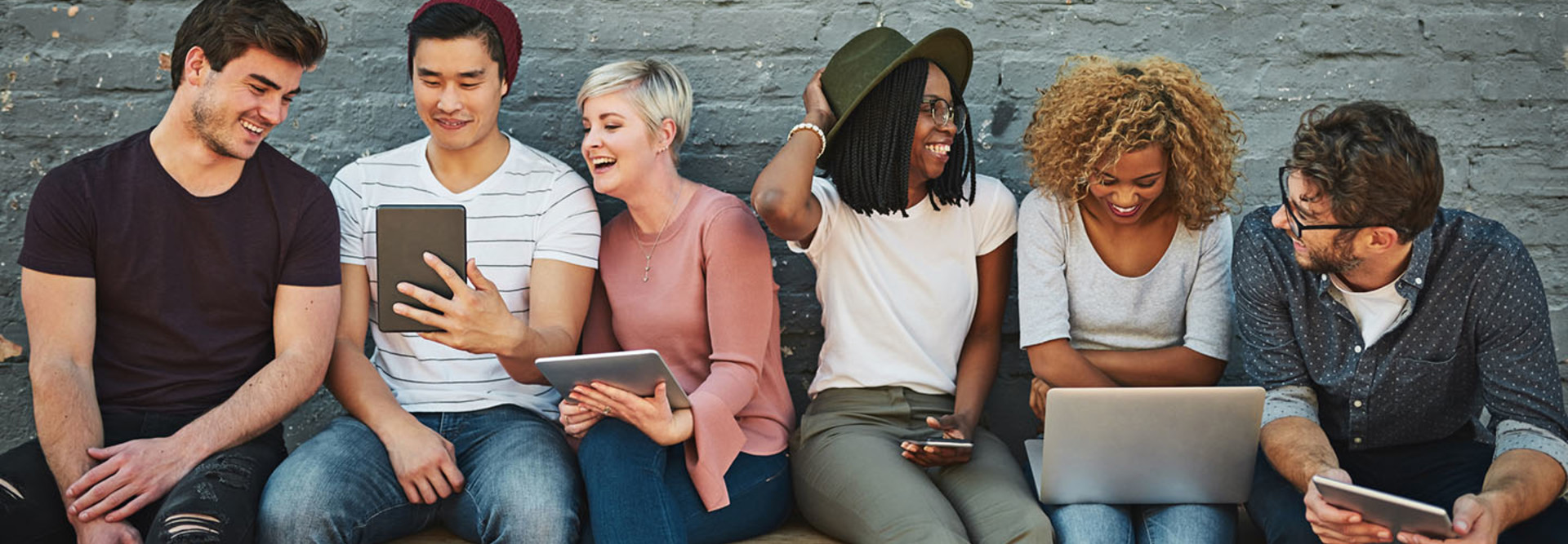 Shot of a diverse group of people social networking outside