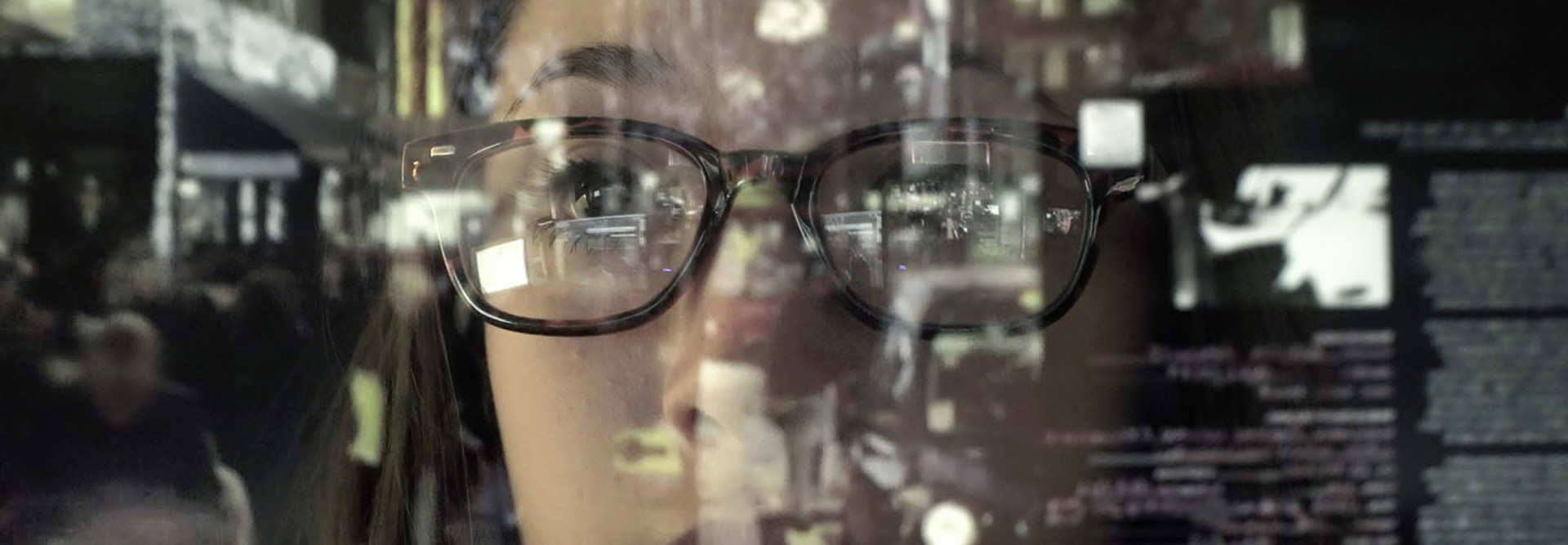 woman concentrating on a touch screen display