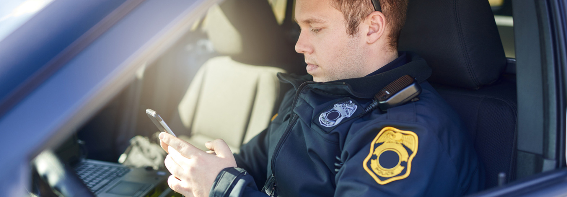 Police officer using a smartphone 