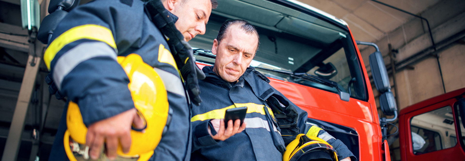 Firefighters using smartphones 