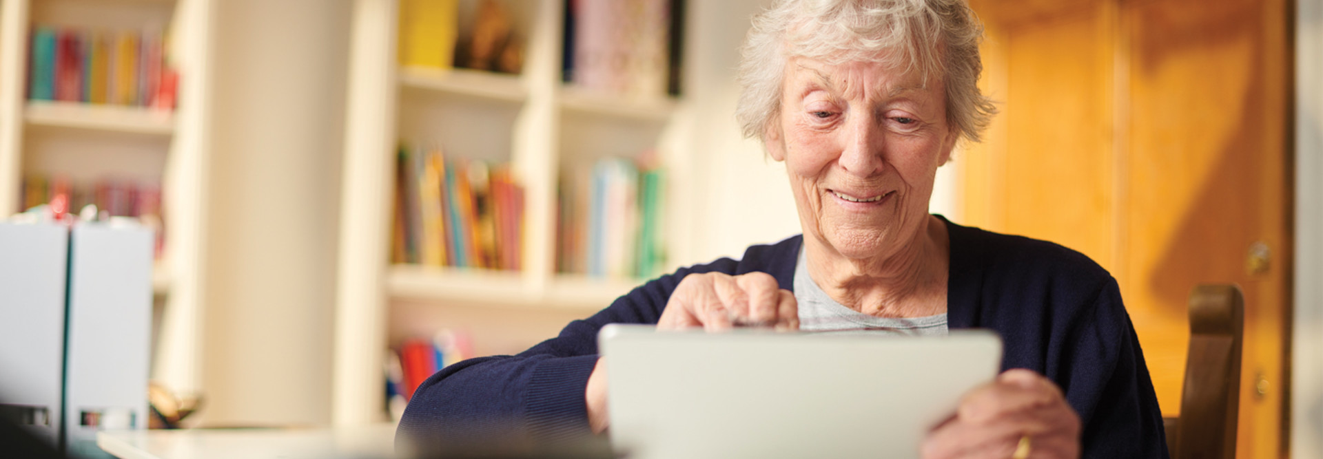 Old woman using a tablet 