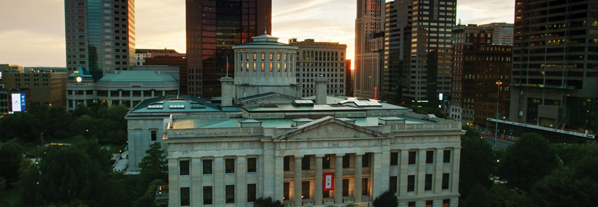 Aerial establishing shot of the Ohio Statehouse in Columbus at sunset.