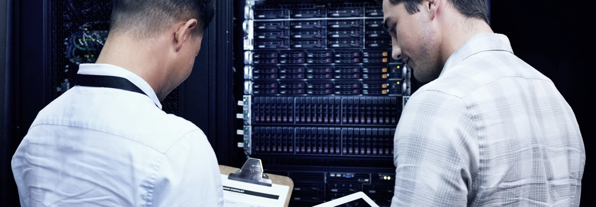 Two people assessing technology