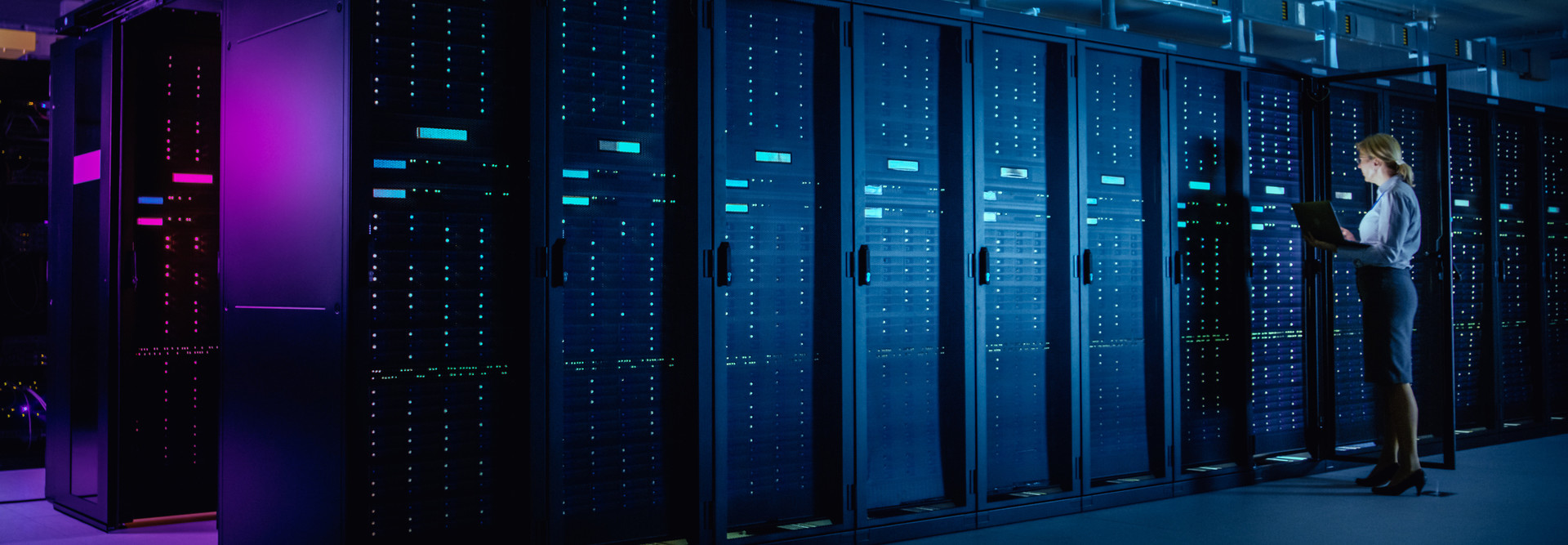 Data center with person working. 