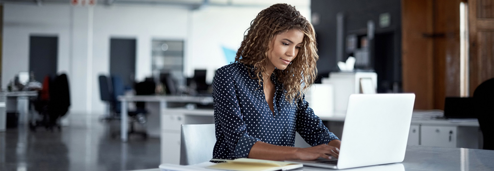 Person working on laptop in office