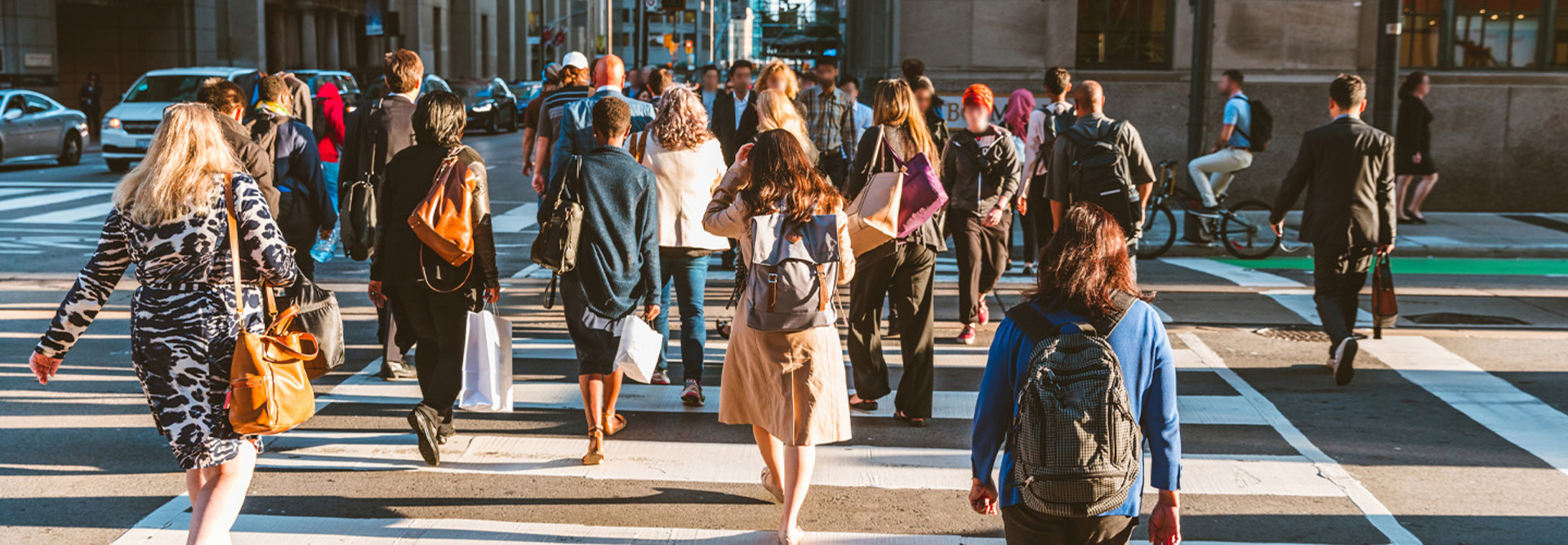 A group of people crossing the street