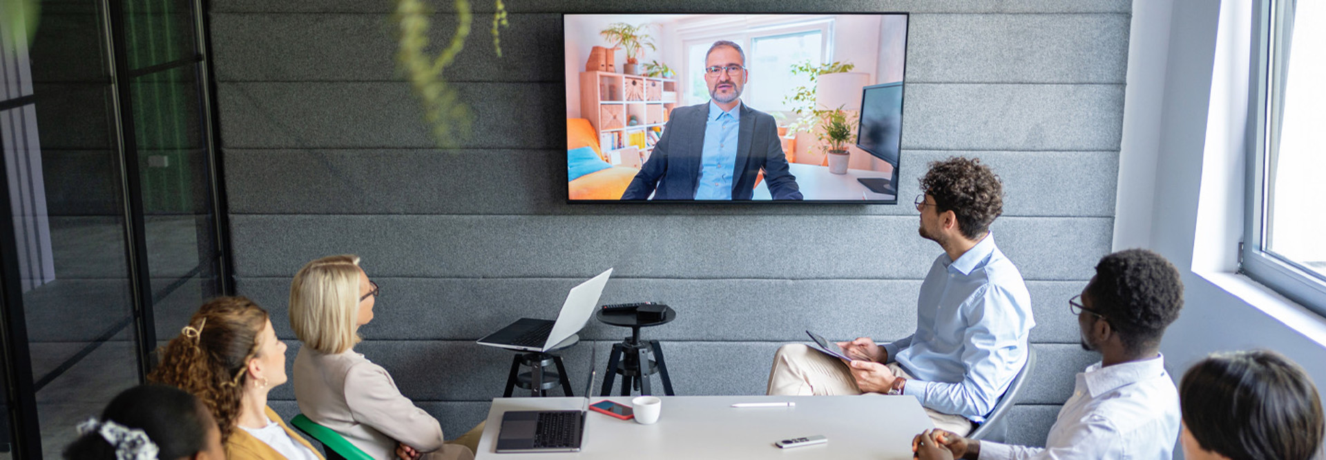 People holding a hybrid meeting