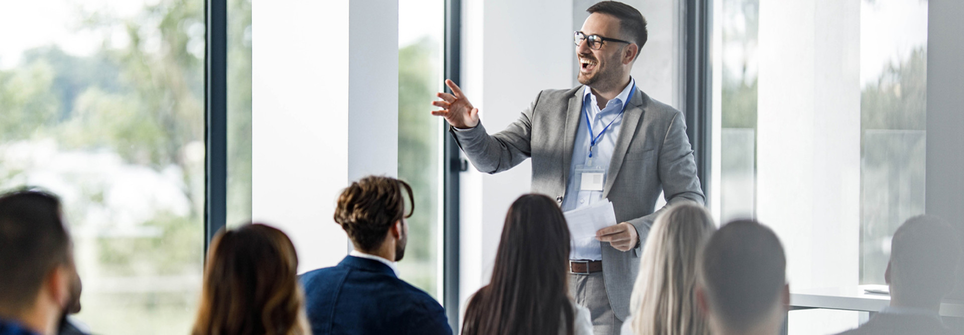 Person presenting at a conference