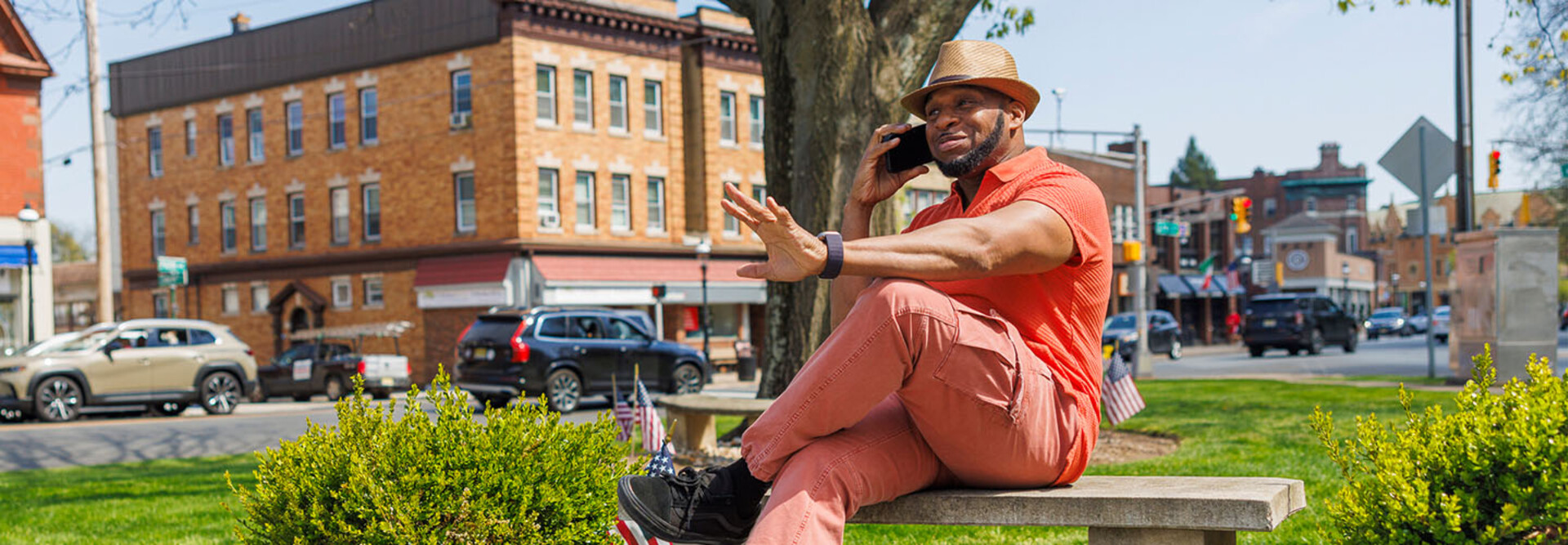 Person talking on the phone in a small town