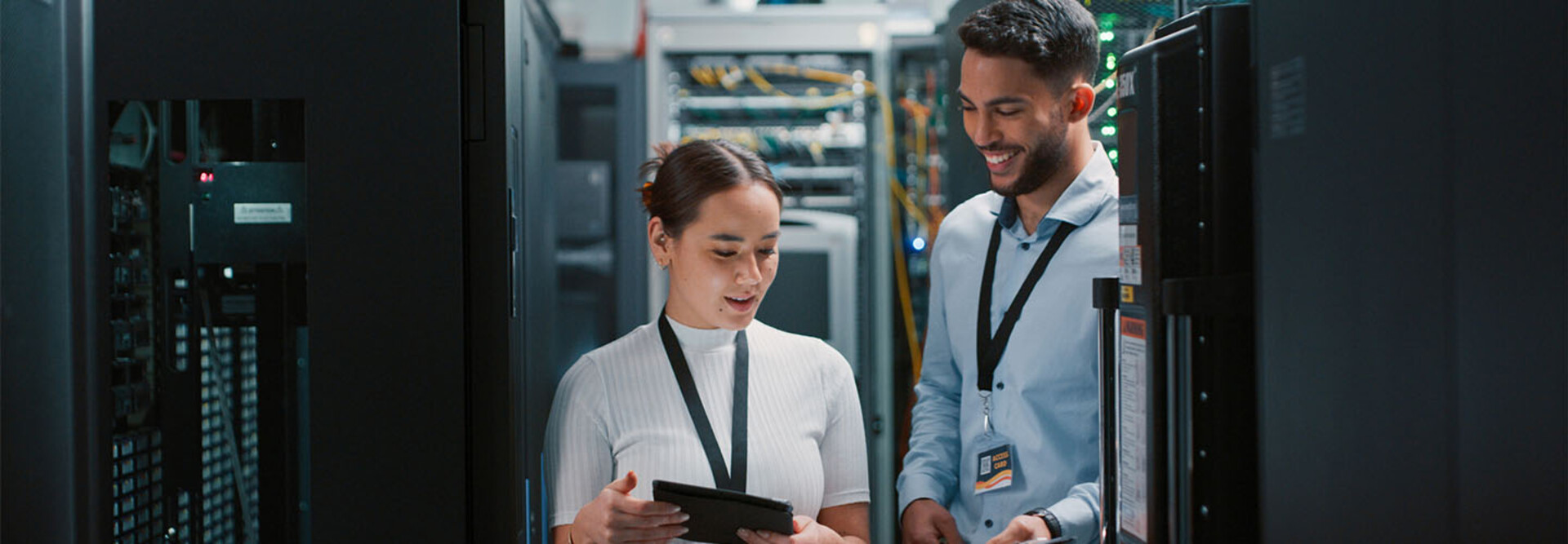 Colleagues working together in a server room