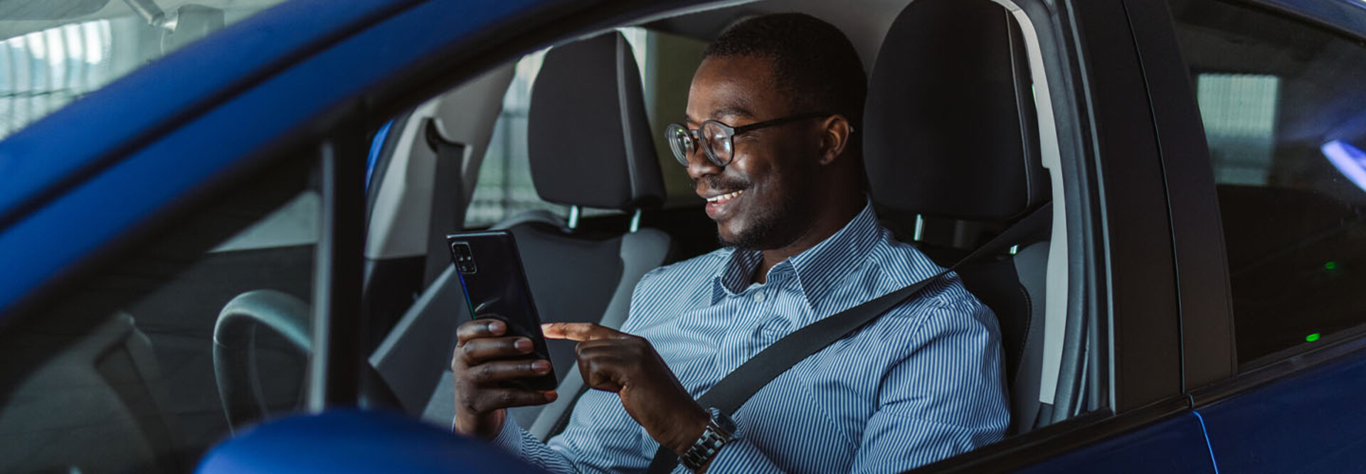 Person accessing phone in vehicle