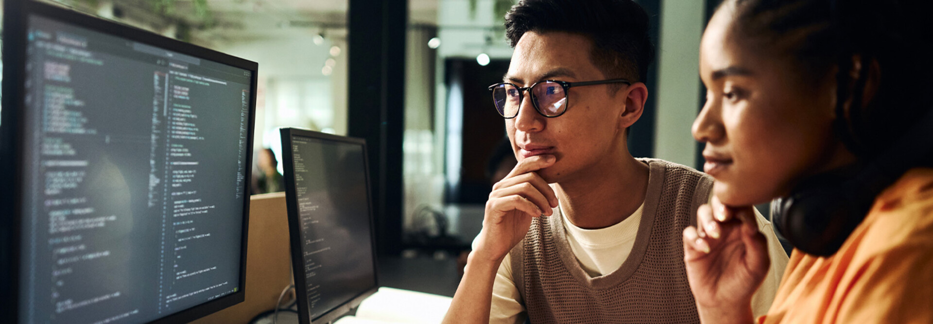 Computer programmers working on code