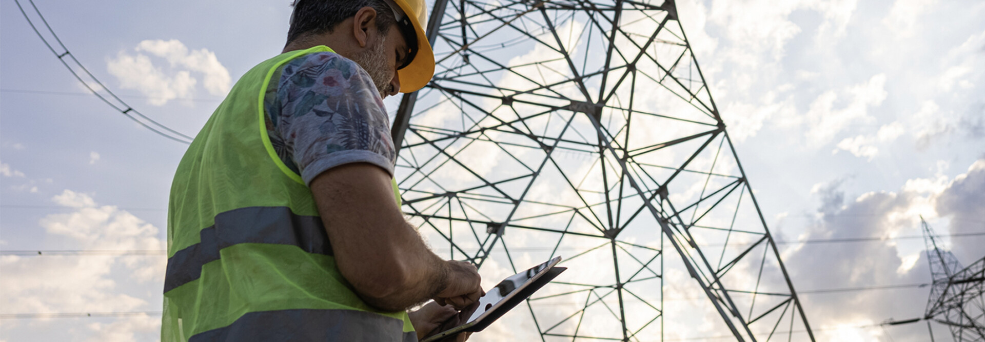 Person using tablet to assess power grid