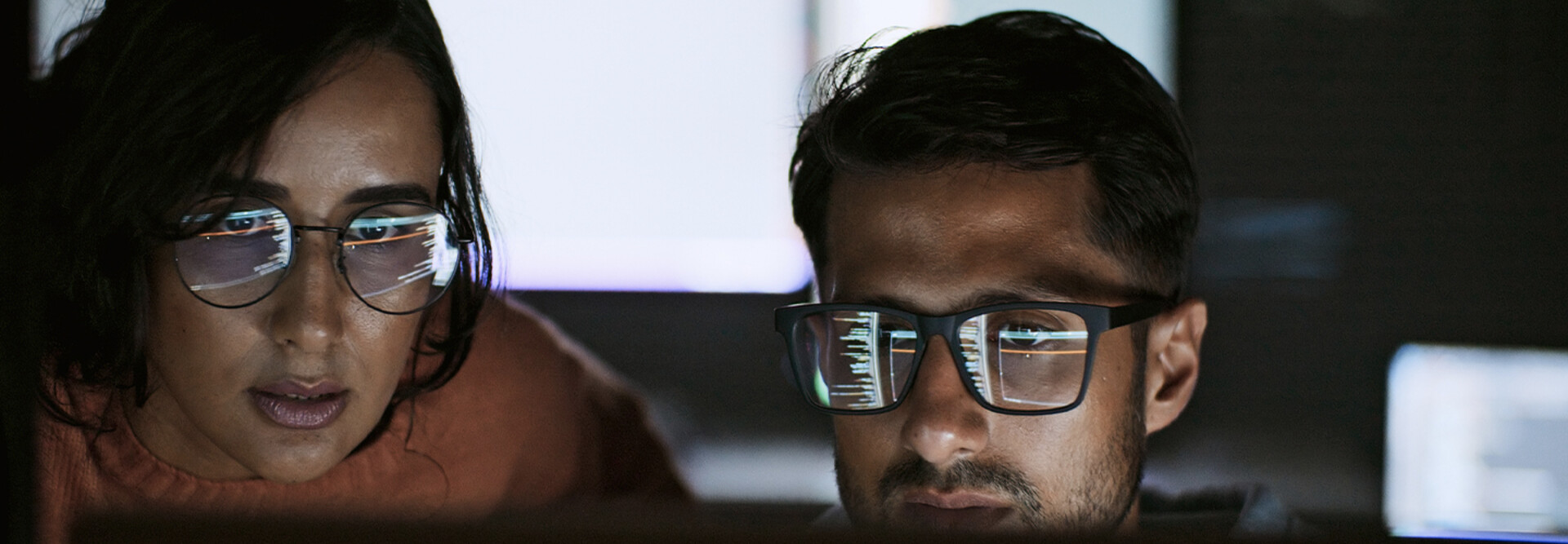 Coworkers reviewing code