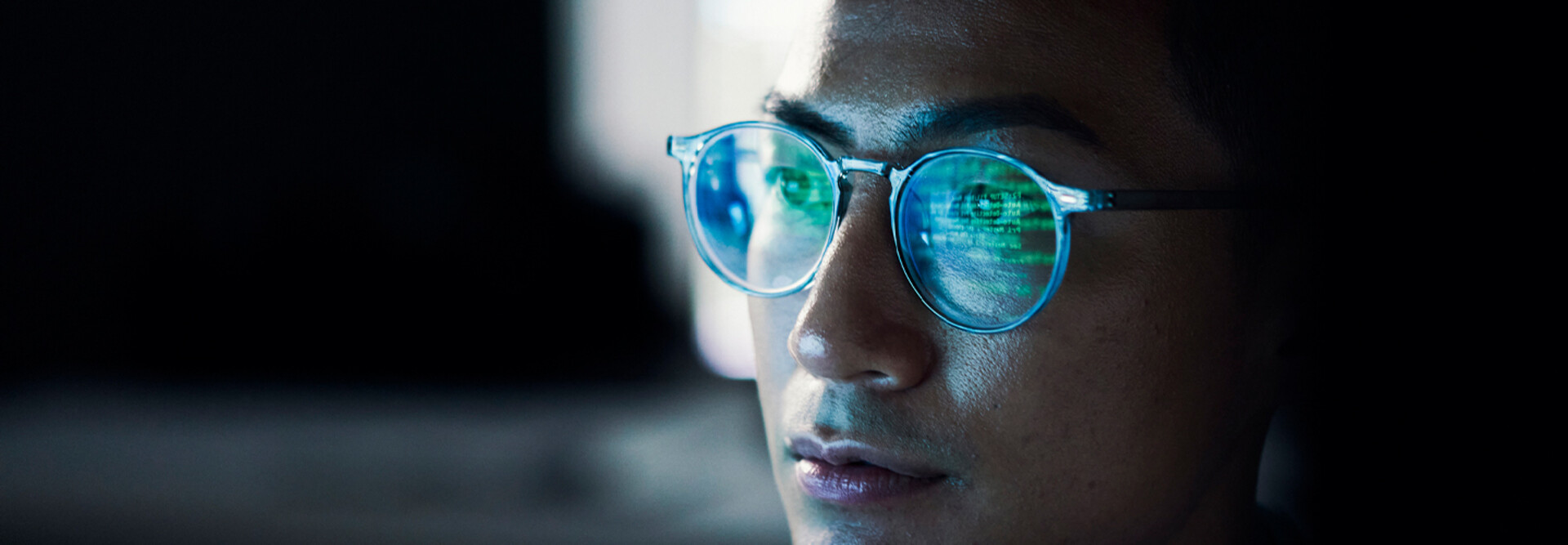 Code reflected in coder's glasses
