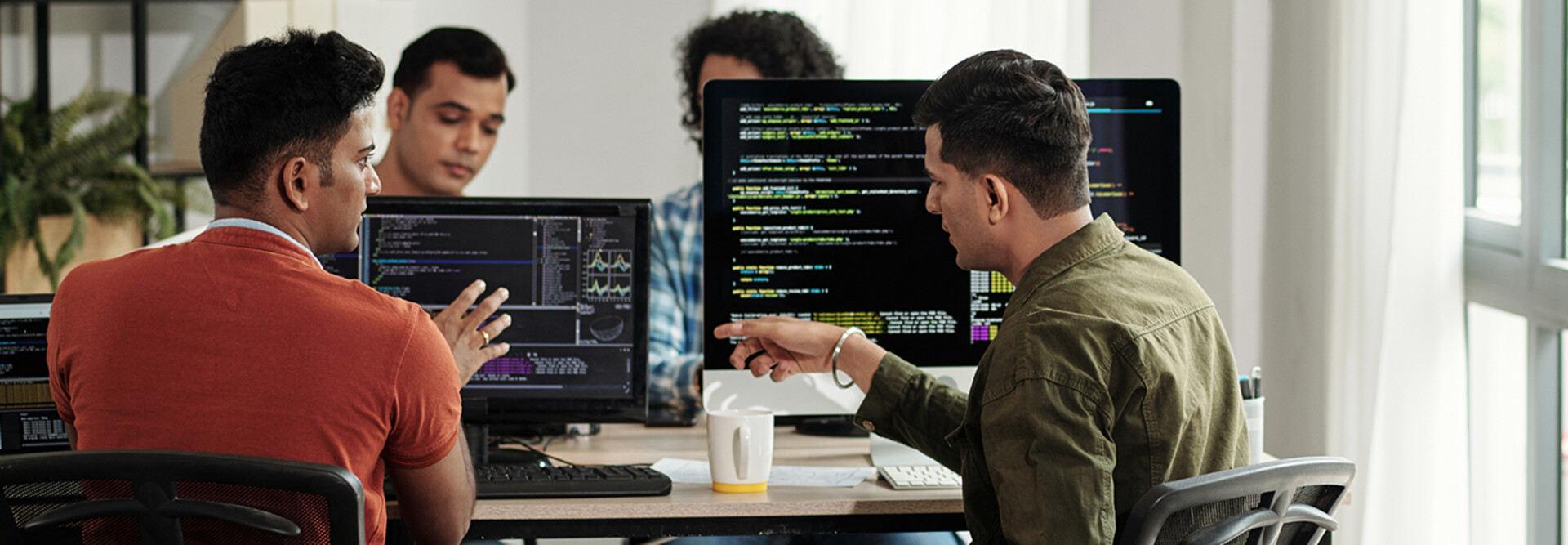 Developers Discussing Programming Code