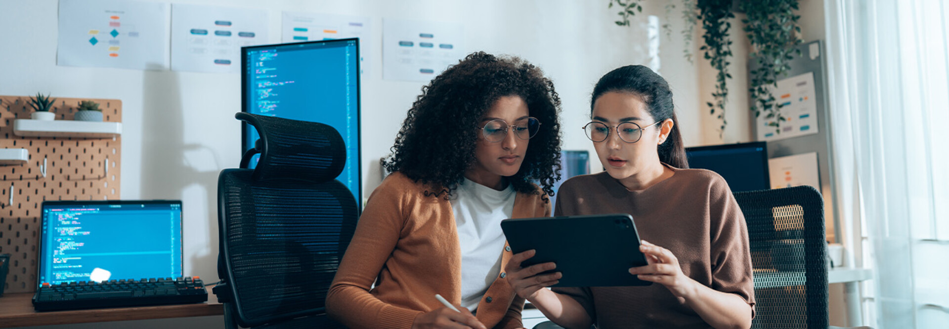 Coworkers viewing tablet