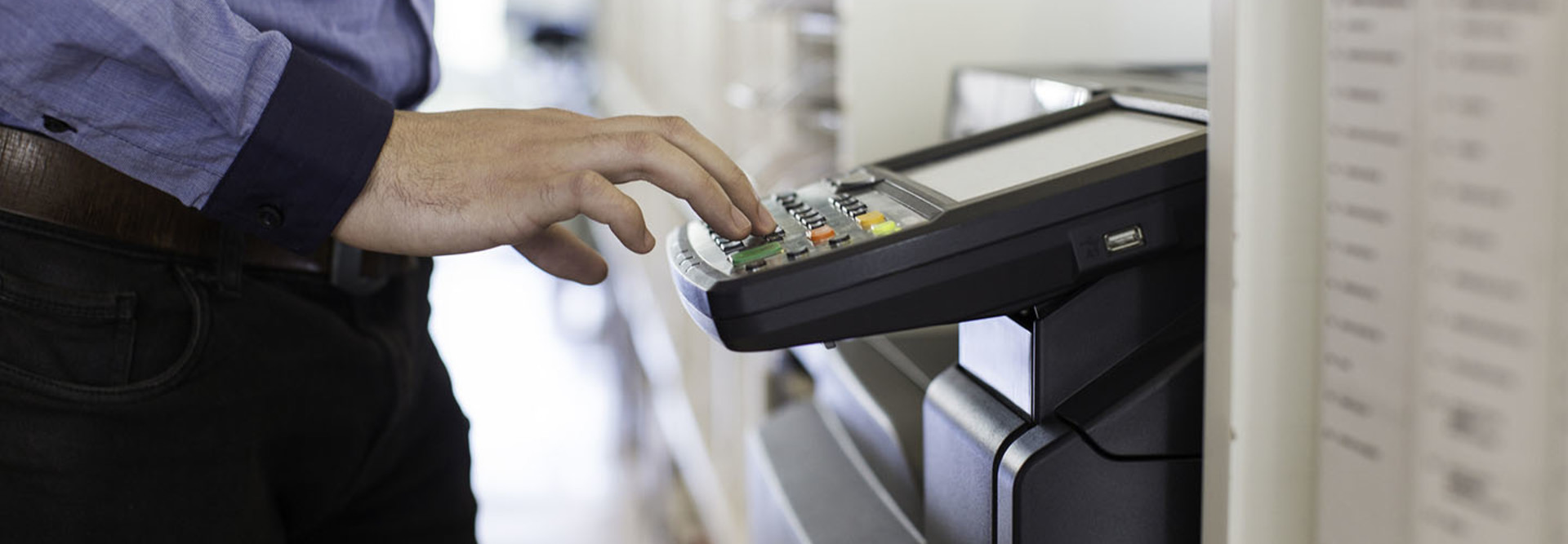 guy touching printer