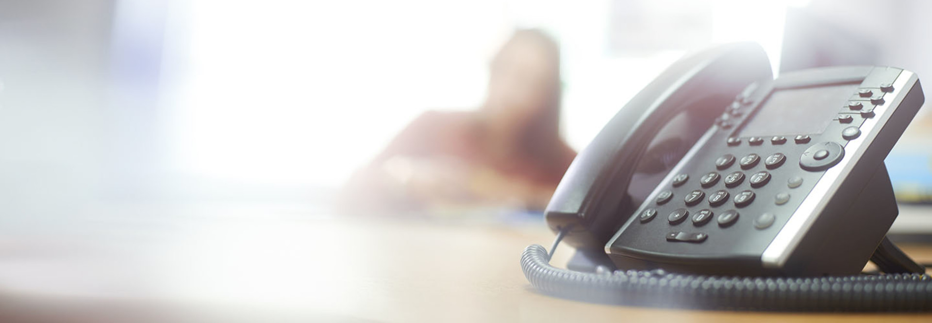 Telephone on desk in call center or office
