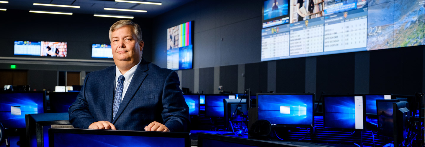 Brett Schneider, Executive Director of the Bexar Metro 911 Network, manages a state-of-the-art facility with robust audio and visual communications.