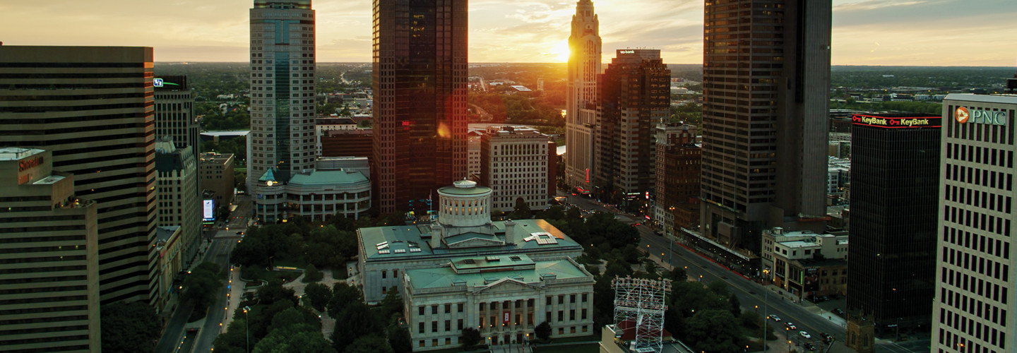 Aerial establishing shot of the Ohio Statehouse in Columbus at sunset.