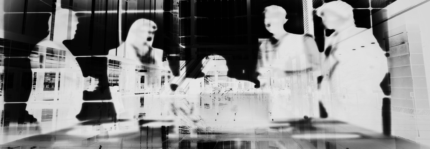 Negative image of people in a meeting