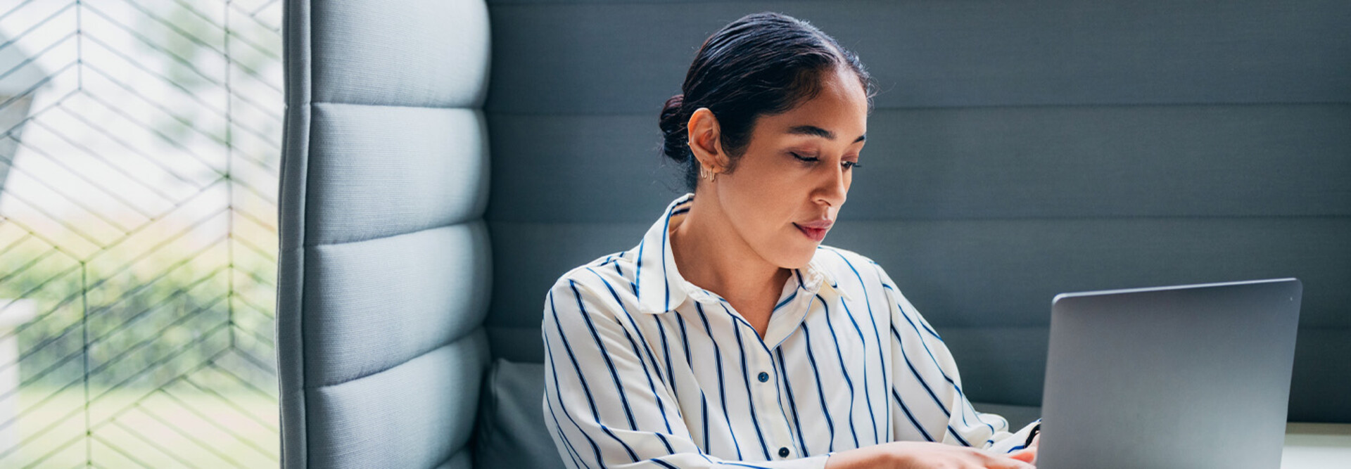 Person working on laptop in office