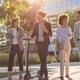 Group of business people waking outside office building