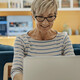 Person using the computer at home
