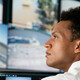 Security worker watching video wall