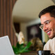 Citizen using laptop in home