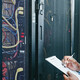 man managing a server room
