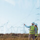 Utility workers examining power lines