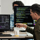 Developers Discussing Programming Code