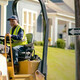 Person patching potholes