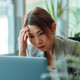 Frustrated person using computer