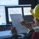 state government construction worker works at computer