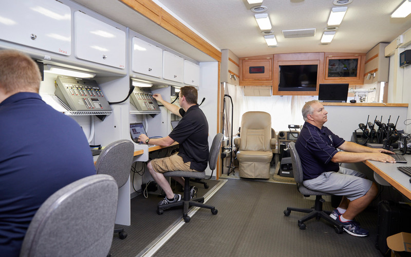 Inside the vehicle, on-scene commanders or representatives from each participating agency take a seat at a desk, where they have access to computer and radio resources.
