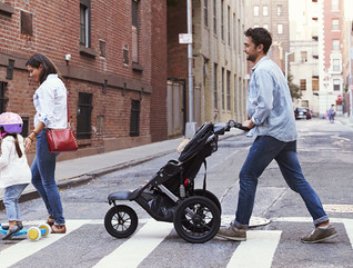 Two families with daughters crossing road