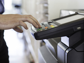 guy touching printer
