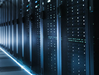 Photo of Out of Focus IT Technician Turning on Data Server.
