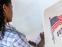 Young black woman voting 