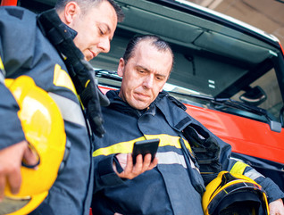 Firefighters using smartphones 