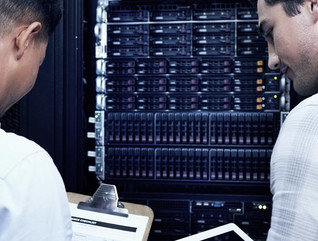 Two people assessing technology
