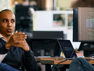 Coworkers discussing solutions at the office