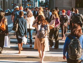 A group of people crossing the street