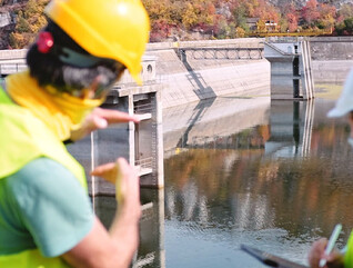 Maintenance engineers working in hydroelectric power station