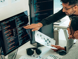 people collaborating on software development